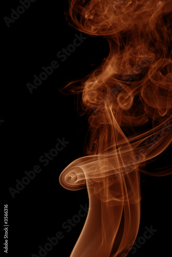 Red-Orange Smoke abstract on black background .