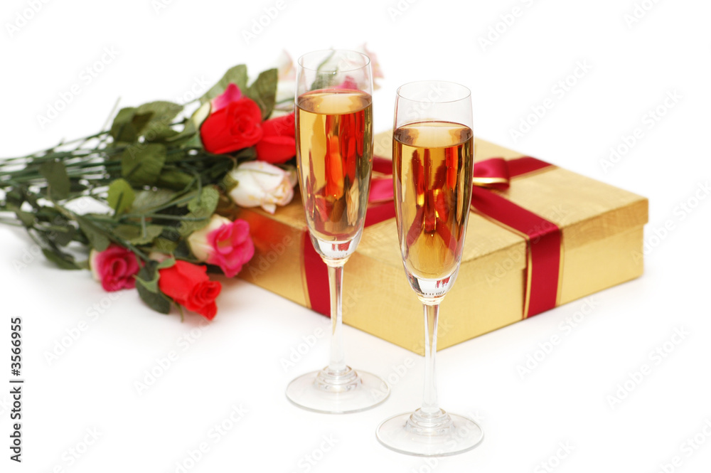 Giftboxes and champagne isolated on the white Giftboxes and champagne isolated on the white