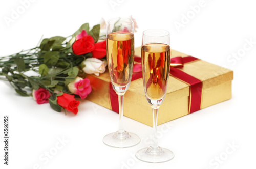 Giftboxes and champagne isolated on the white