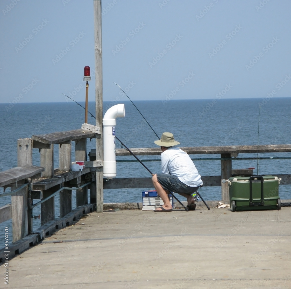Man with a hat fishing in Southern Maryland usa