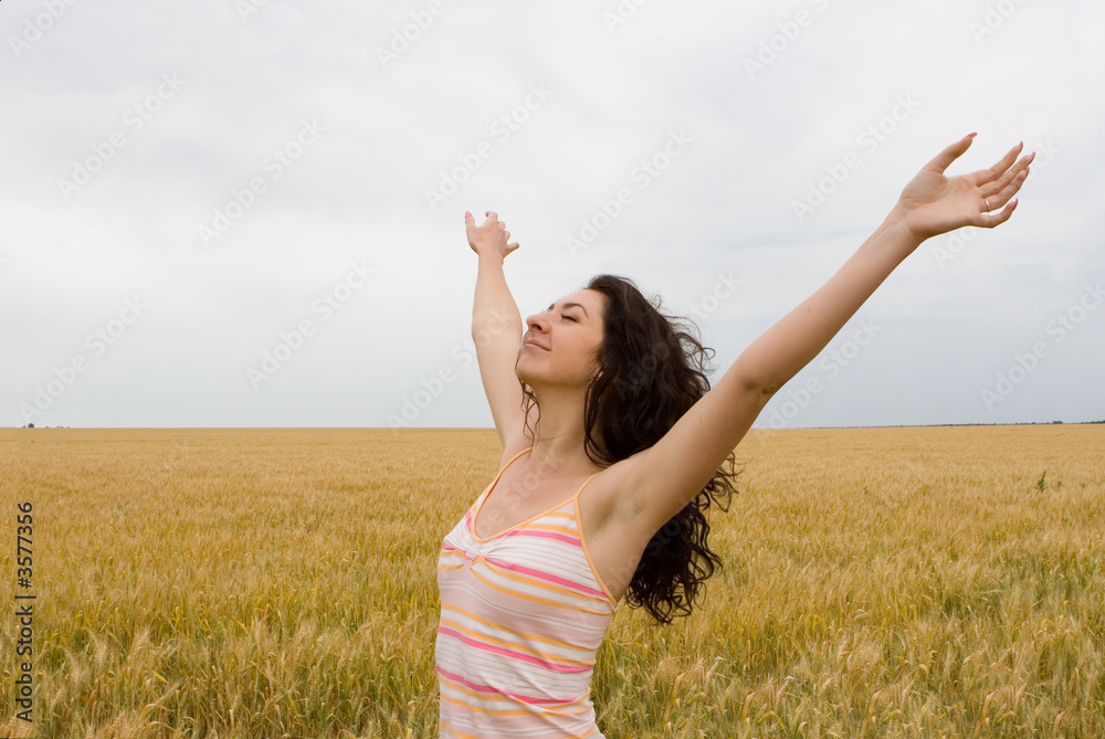 The beautiful girl relaxation in golden meadow The beautiful girl relaxation in golden meadow