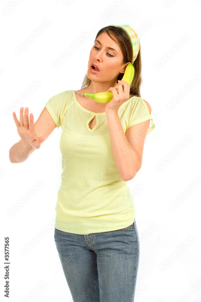Girl conduct conversation using banana as phone Girl conduct conversation using banana as phone