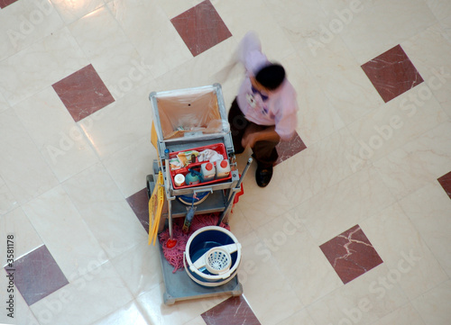  sweeper and his broom in a mall