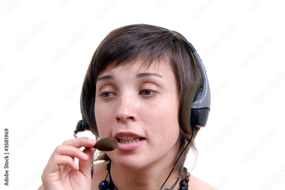 Woman secretary with hands free set answering a call Woman secretary with hands free set answering a call