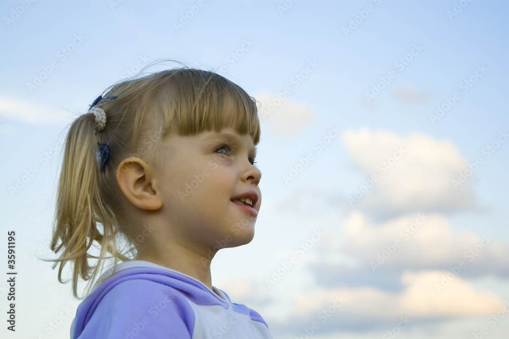 The little girl plays on a meadow The little girl plays on a meadow
