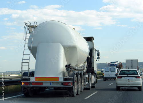 late hours in a highway - heavy traffic with trucks and cars