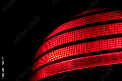 A red plastic automobile tail light signal. photo
