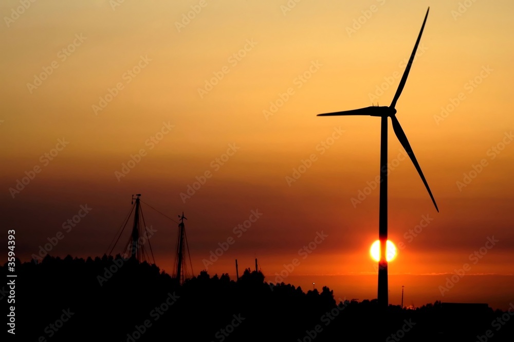 wind turbine for alternative energy in sunset
