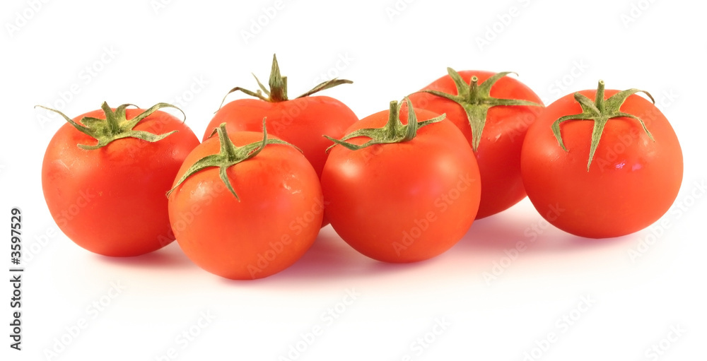 Some tomato lay on a white background.