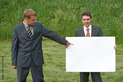 businessmen and sheet of paper