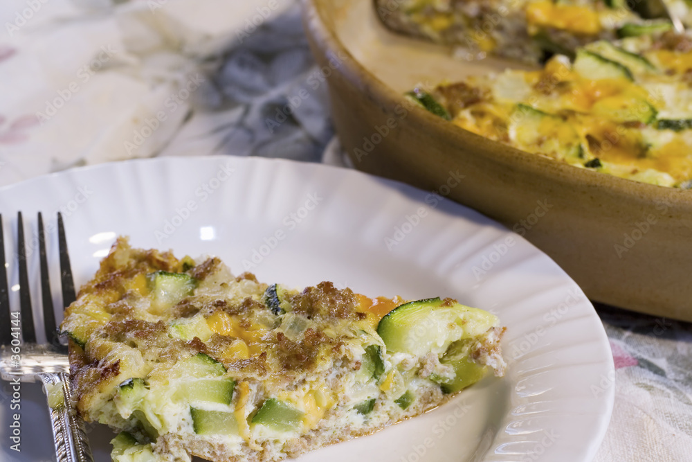 Zucchini Casserole made with Sausage, Cheese, and Onions.