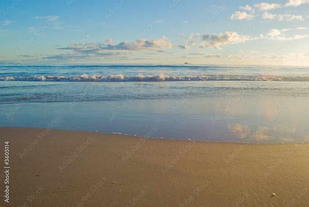 a nice beach scene with gentle waves reaching the sand a nice beach scene with gentle waves reaching the sand