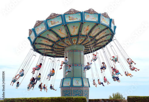 people having fun with riding a modest carrousel