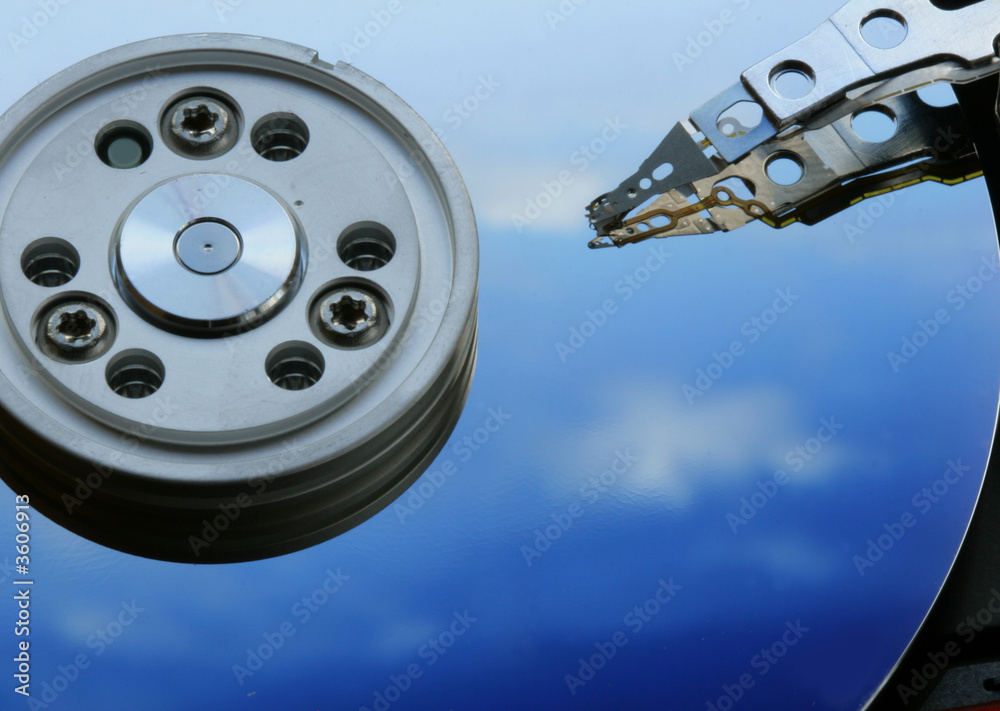 Hard drive disk with sky reflection close-up Hard drive disk with sky reflection close-up