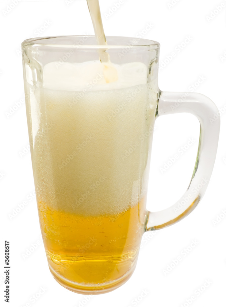 Glass mug with a jet foamed by cold beer Glass mug with a jet foamed by cold beer