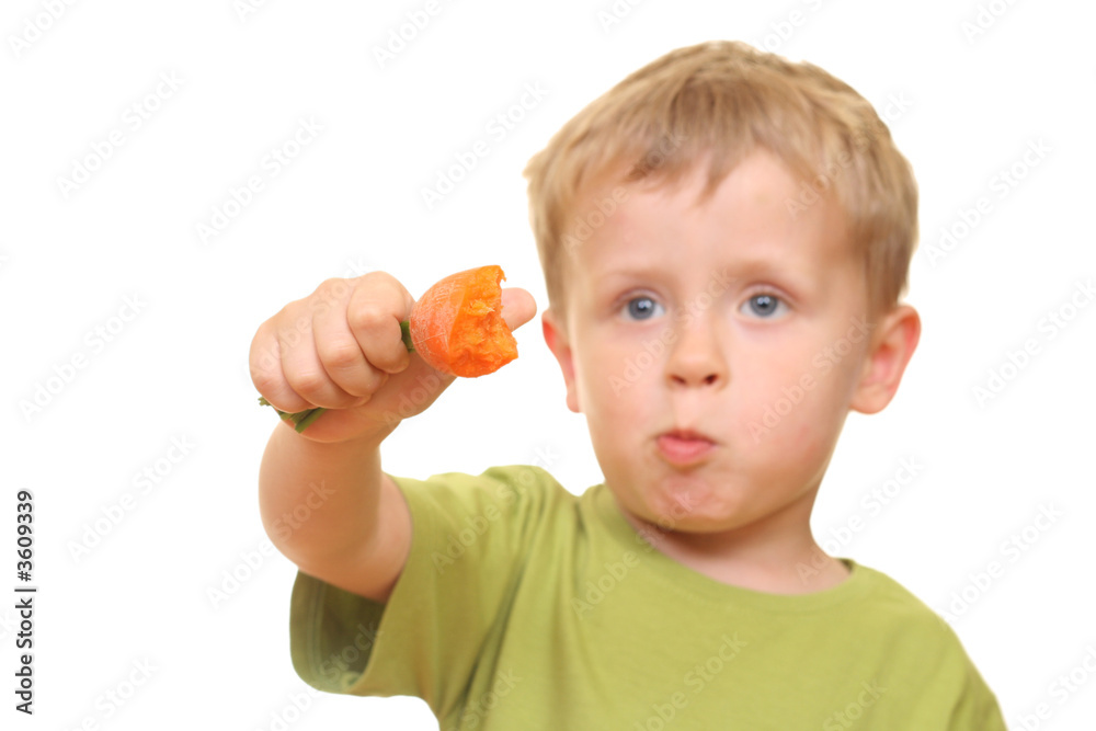 three years old boy eating fresh carrot isolated on white three years old boy eating fresh carrot isolated on white