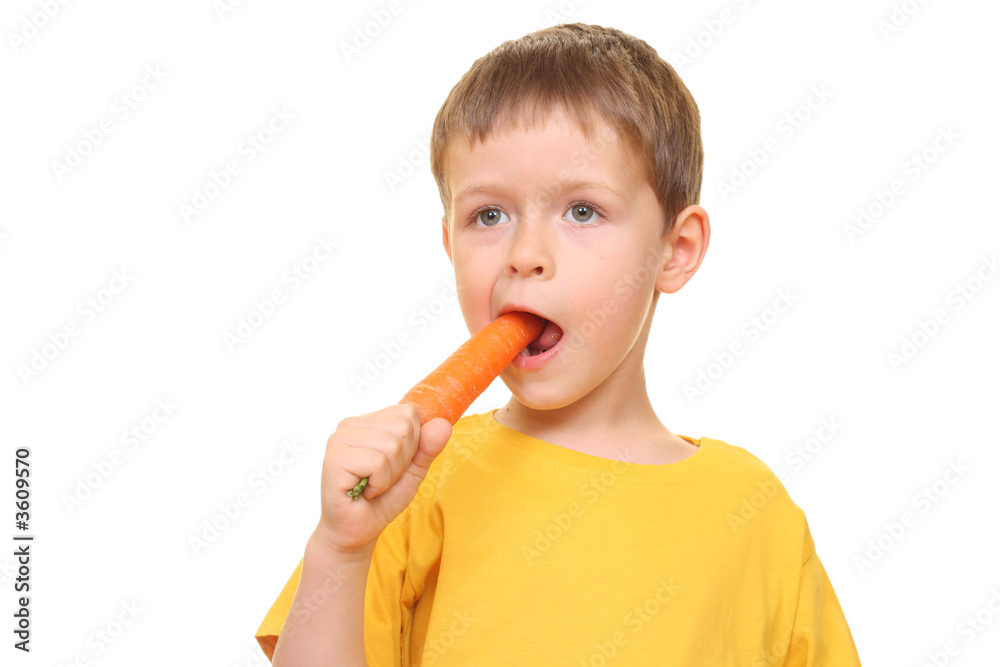 five years old boy eating fresh carrot isolated on white five years old boy eating fresh carrot isolated on white