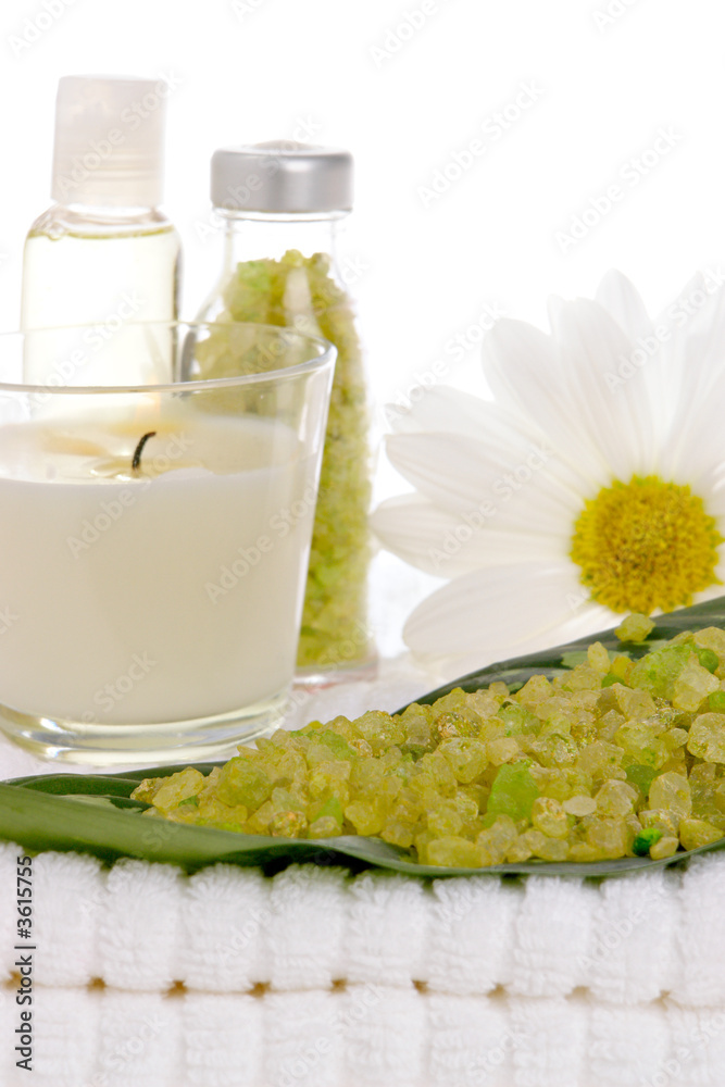 Spa salt, candle, daisy, and bottles Spa salt, candle, daisy, and bottles