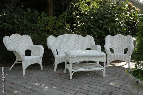 white wicker furniture on brick