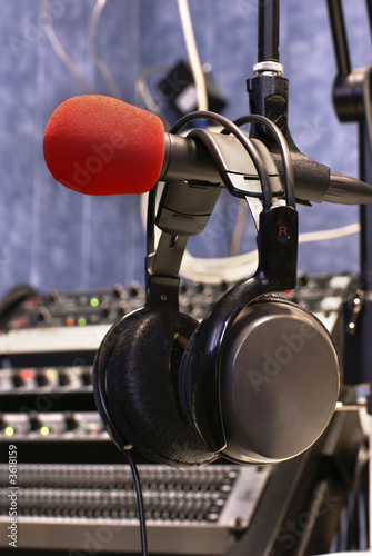 Microphone with head phones in broadcasting station