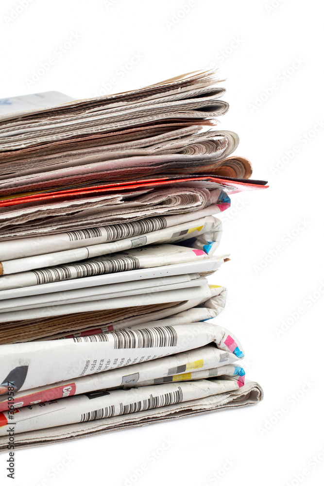A stack of local newspapers with focus on front. Shallow DOF A stack of local newspapers with focus on front. Shallow DOF