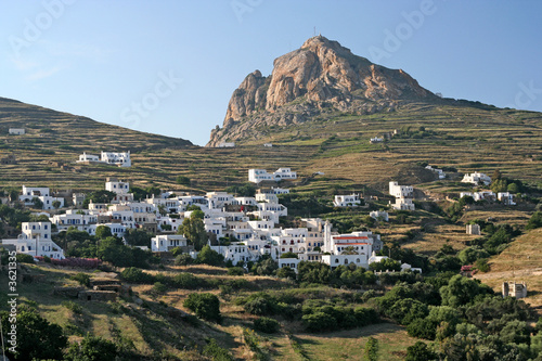 A typical Greek island village under a rock in Tinos island
