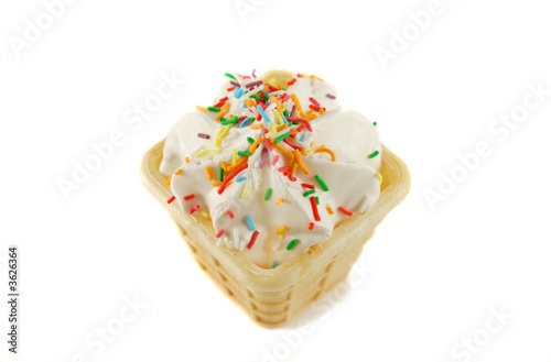 Sweet marshmallow cone with colored cake sprinkles. photo