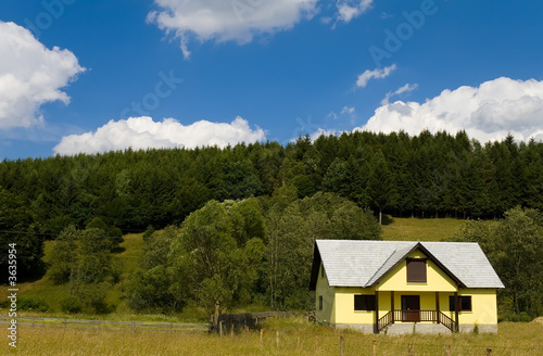 Weekend house in the mountains on a sunny day