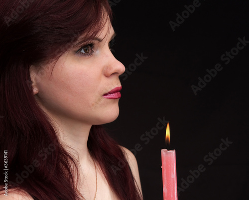 Girl and burning candle