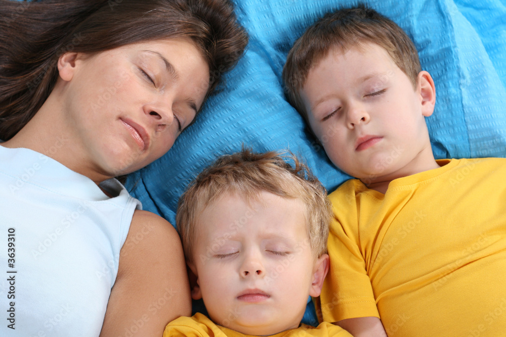 sweet dreams - mother and two sons sleeping
