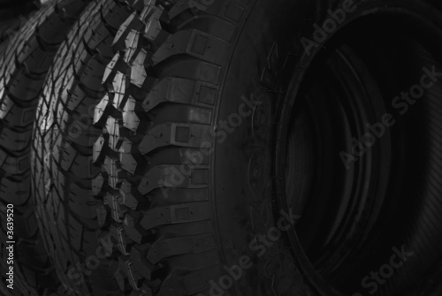 Row of the black automotive tires