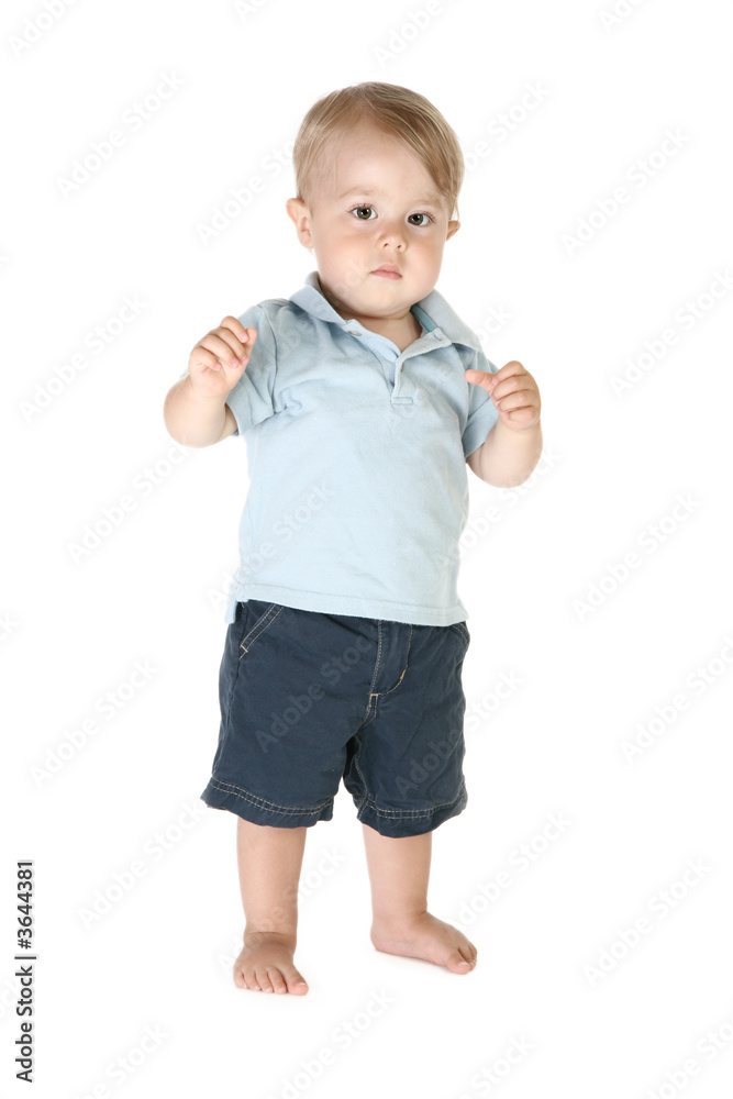 Adorable one year old boy toddler barefoot over white. Adorable one year old boy toddler barefoot over white.