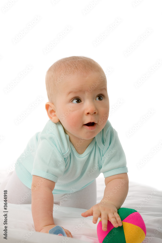 the amazed boy to sit on white blanket