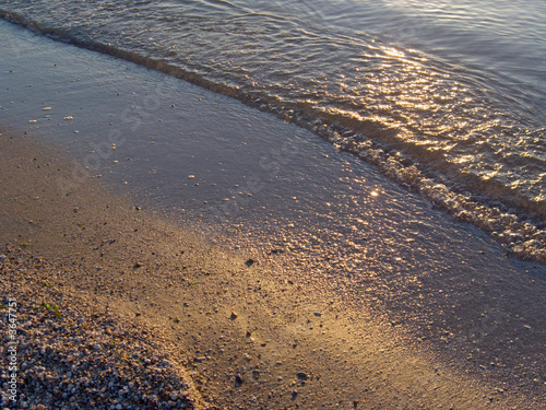 Evening sand coast surface with sunset catchlights 