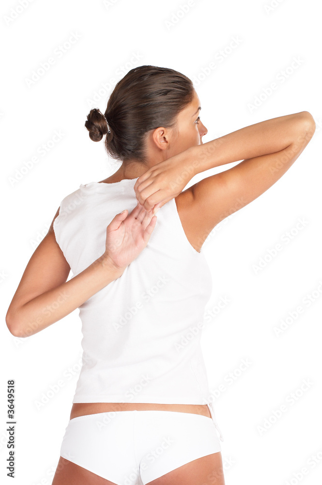 Beautiful woman stretching - high key shot in studio Beautiful woman stretching - high key shot in studio
