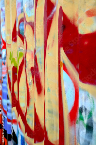 Graffiti sprayed on the side of a storage container.