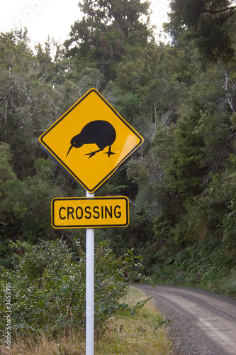 Fototapeta Naklejka Na Ścianę i Meble -  A Kiwi Crossing sign near Boundary Stream Reserve, New Zealand. 