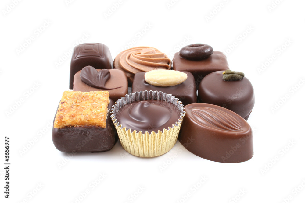 close-ups of mixed chocolates isolated on white close-ups of mixed chocolates isolated on white