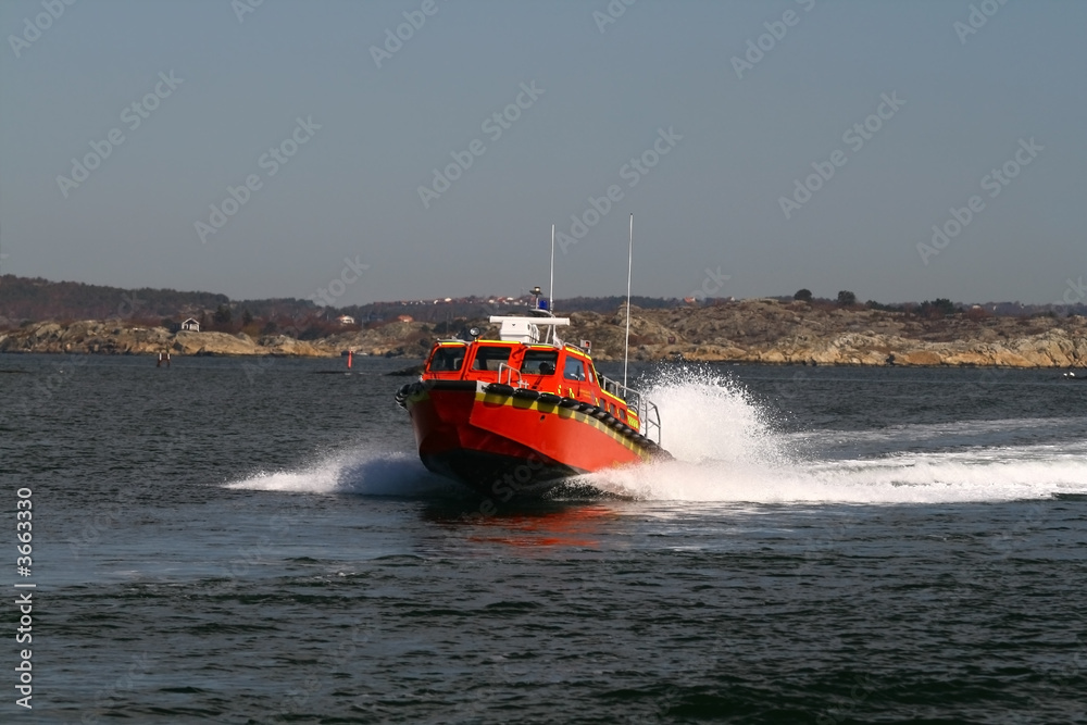 Fototapeta premium Rescue boat in the Northern Sea 