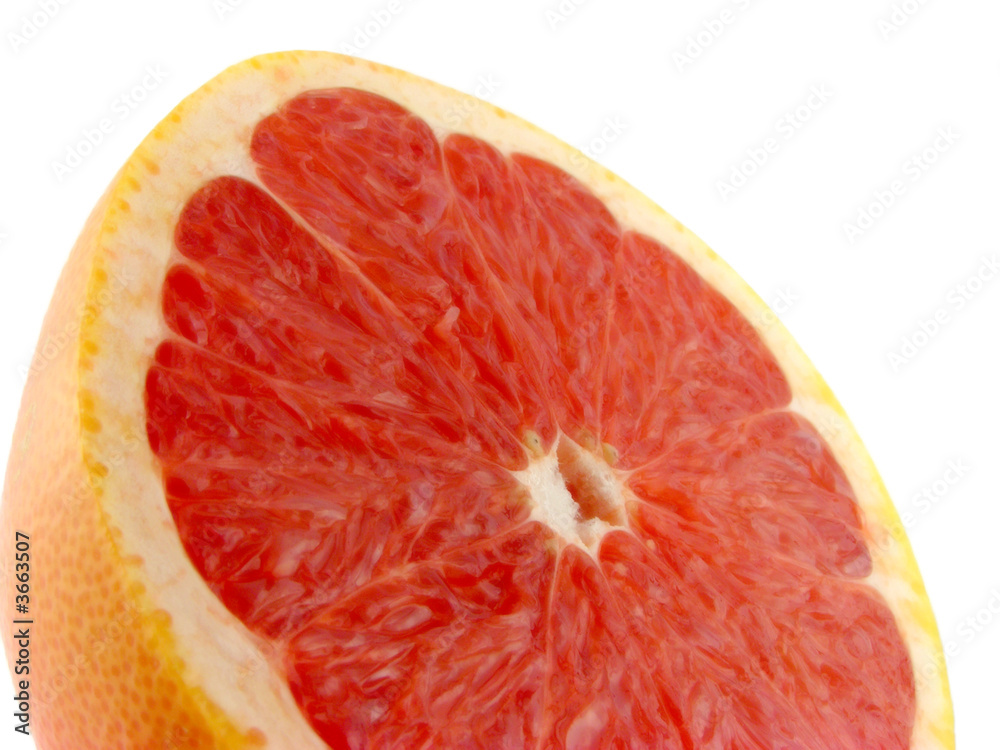 Slices of a grapefruit. A close up. Isolated on a white. Slices of a grapefruit. A close up. Isolated on a white.