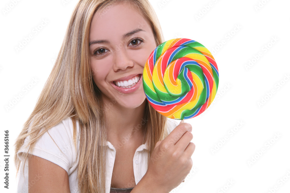 A young pretty woman with a lollipop over white