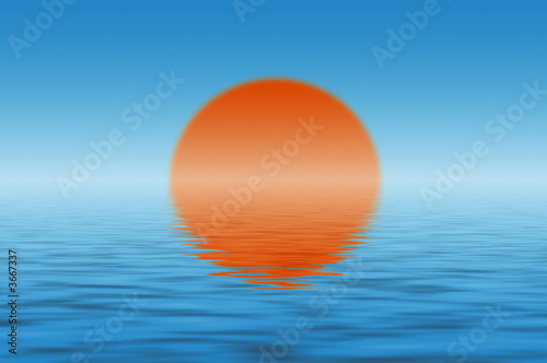 Sun over the sea and its reflection in water
