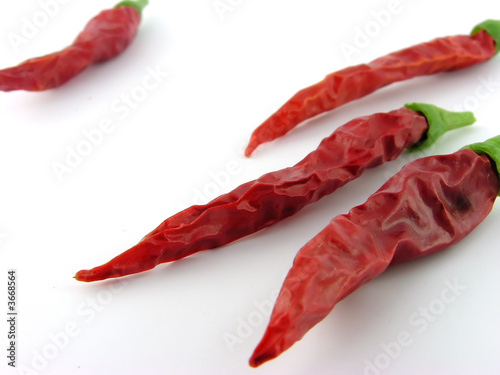 Spices. Pepper. A close up. It is isolated on a white.