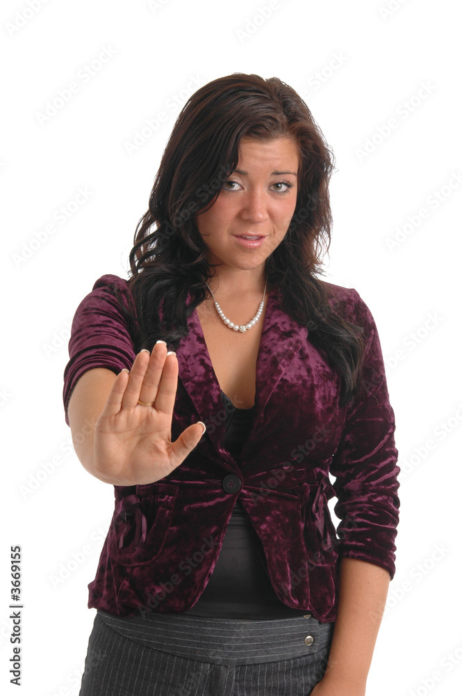 A girl holding out her hand in rejection to something A girl holding out her hand in rejection to something