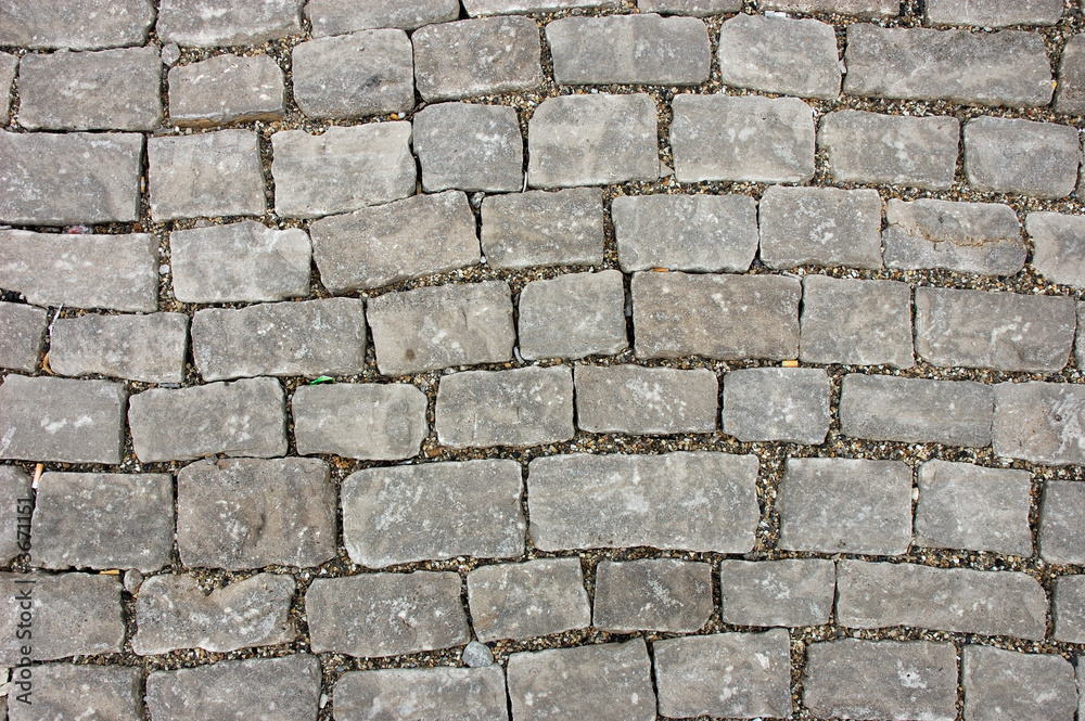 Obraz premium Cobblestone pavement, great for background and texture