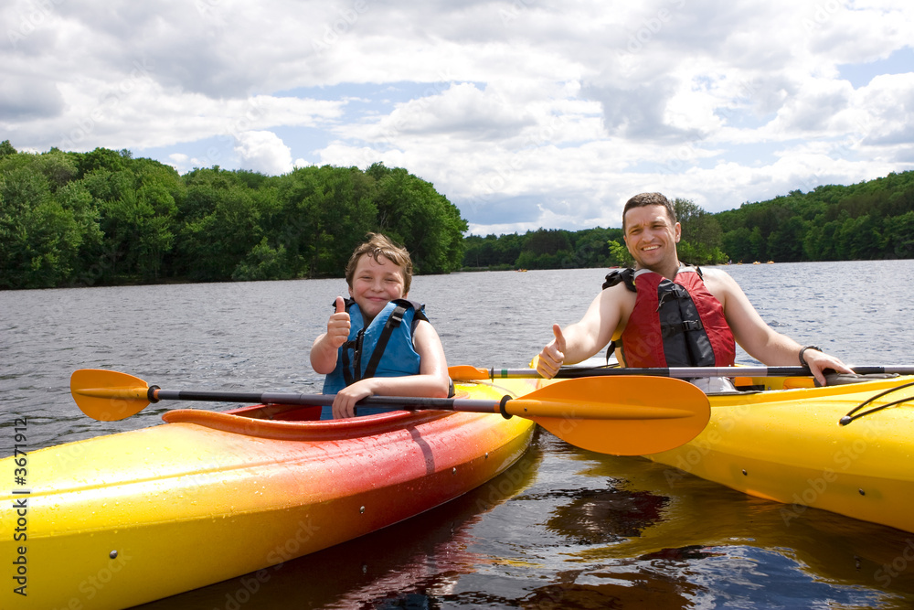 © Olga Lyubkin - Father and son enjoying kayaking