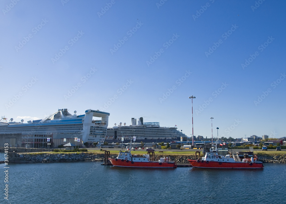 Pilot boats rest after guiding cruise ships to harbour