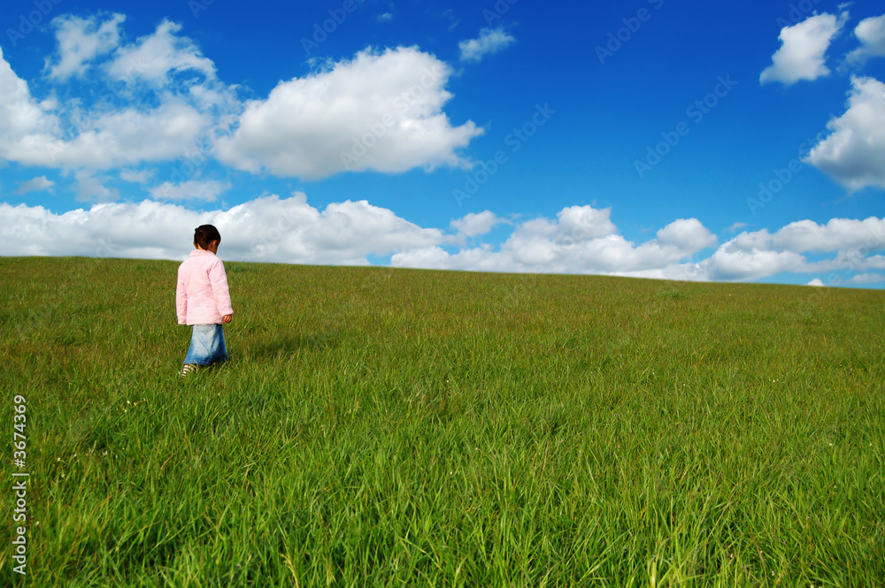 little girl in a field