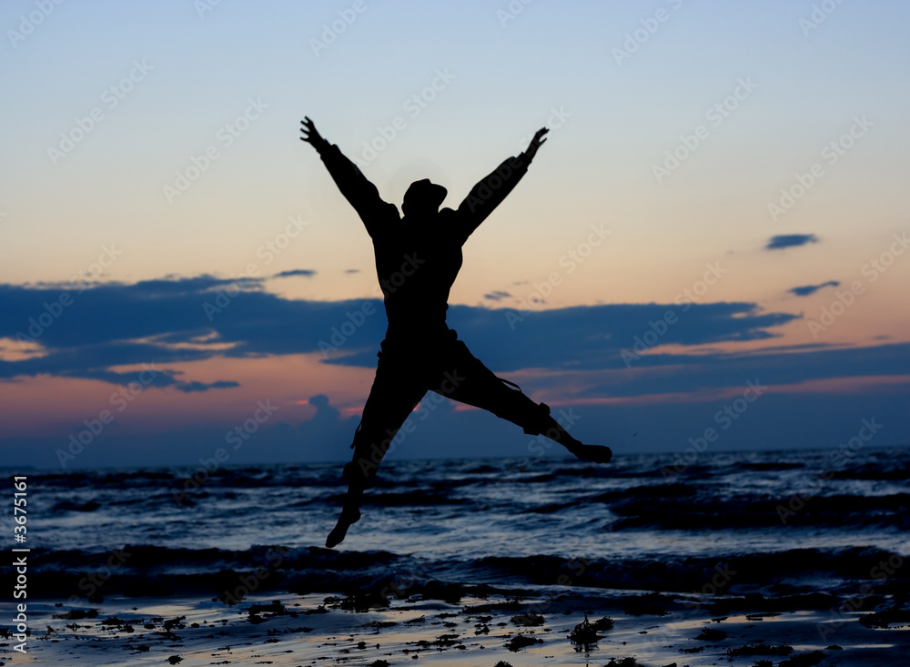 Man jumping near sea.