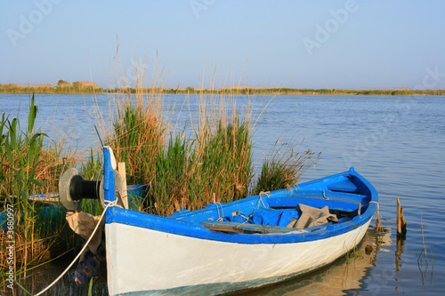 Old wooden rowing boat on the river